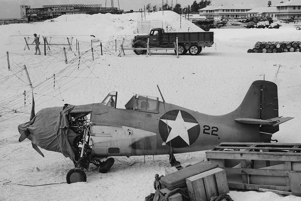 Despite being wounded in both legs, Captain John F. Carey managed to return his shot-up Wildcat to Midway. (National Archives)