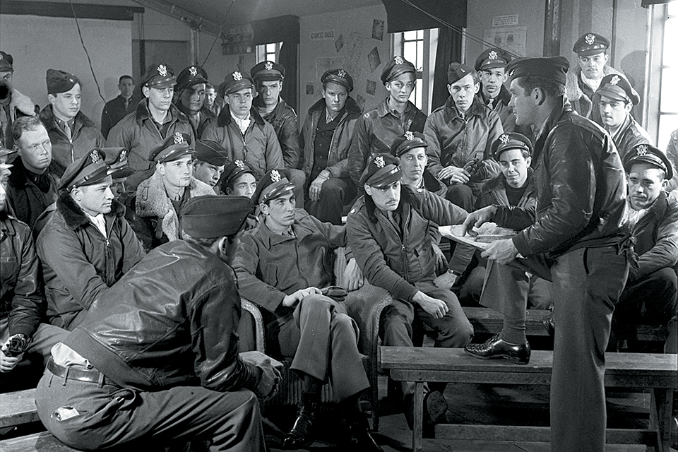The 4th Fighter Group commander briefs his pilots. (Getty Images)