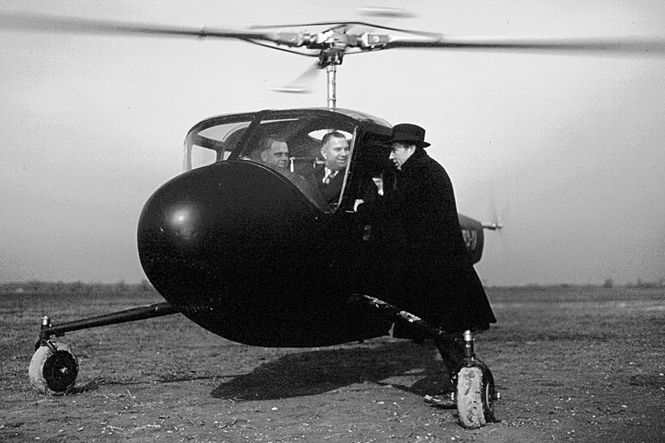 Carlson prepares to take Larry Bell for a spin in Ship 2, as Young looks on. (Niagara Aviation Museum)
