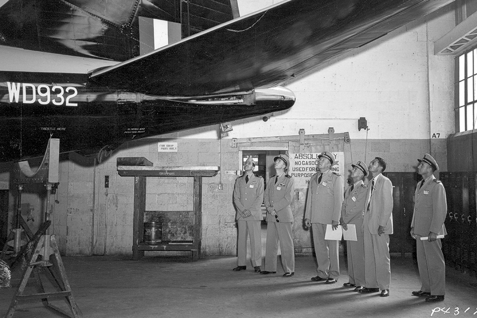A group of U.S. Navy officers examine the newly arrived WD932. (National Archives)