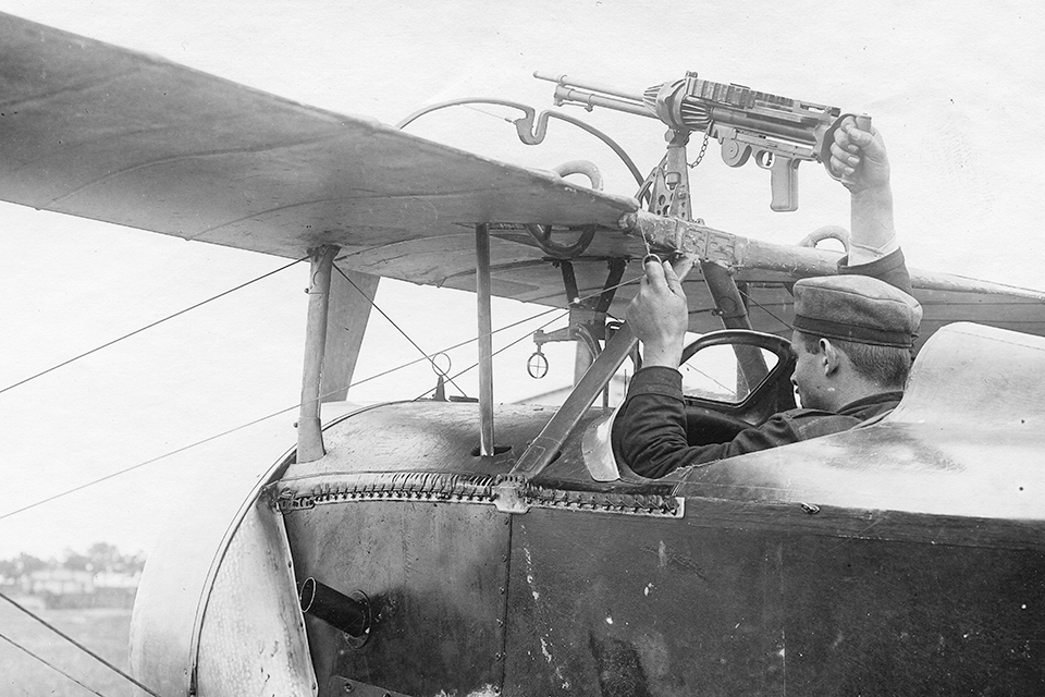 A German mechanic examines the above-wing Lewis gun mounting on a Nieuport 16 after the fighter was captured on May 22,1916. (Courtesy Jon Guttman)