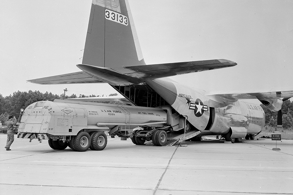The large tail is mounted high above the cargo ramp of the Hercules, giving easy access to troops and larger cargo like this fuel truck. (Bettmann/Getty Images)