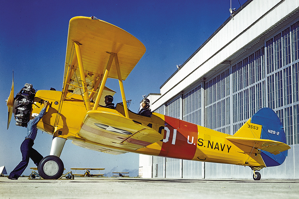 A Navy crewman hand-cranks an N2S-2’s Lycoming R-680 engine at NAS Corpus Christi, Texas, in 1943. (U.S. Navy)