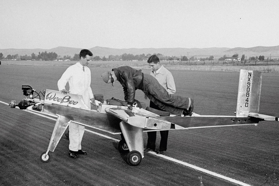 James Wilder, left, prepares to strap test pilot Bouck into the Wee Bee for its first flight. (Peter Stackpole/Time Life Pictures/Getty Images)