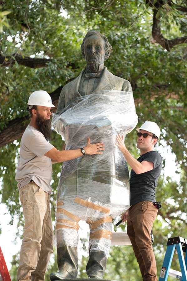 Off to a New Home: Serious workers ready another Jefferson Davis statue for its removal from the grounds of the University of Texas campus. The statue was relocated to an exhibit in the university's Briscoe Center for American History. (Photo by Robert Daemmrich Photography Inc/Corbis via Getty Images)