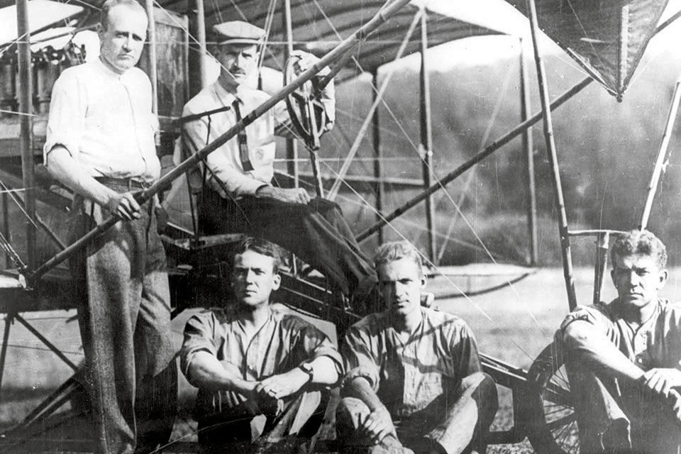 Sitting below Glenn Curtiss (right) and one of his employees in 1911 are (from left) Beck and Navy Lieutenants John Towers and Theodore Ellyson, the first U.S. naval aviator. (National Archives)