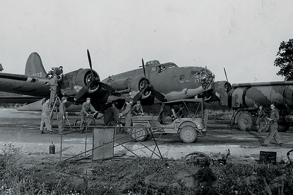 Ground crewmen prep "Yankee Doodle" for another mission from Polebrook. (Imperial War Museum FRE882)
