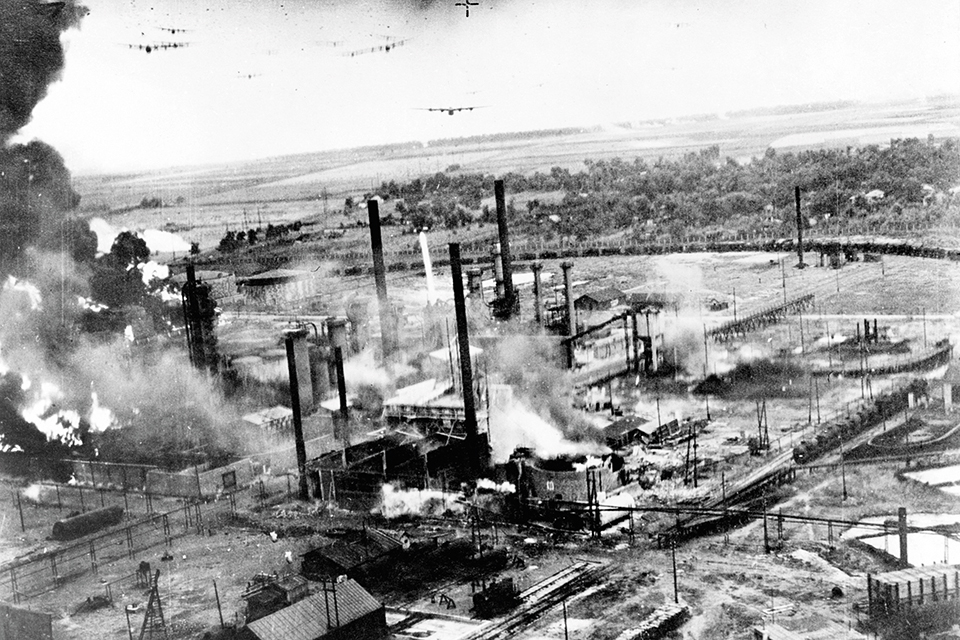 A wave of B-24Ds from the 44th Bomb Group bores in on Ploesti's burning Colombia Aquila refinery on August 1. (National Archives)