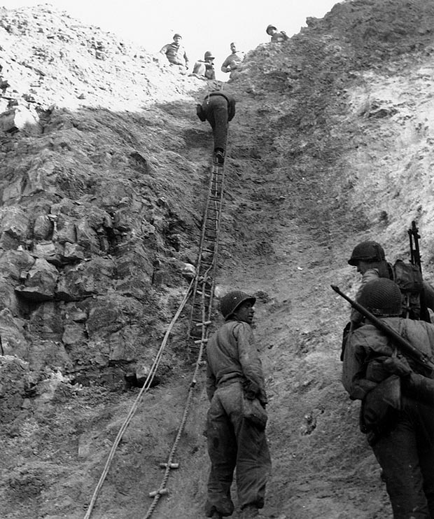 U.S. Army Rangers show off the ladders they used to storm the cliffs at Pointe du Hoc. (U.S. Navy/National Archives)