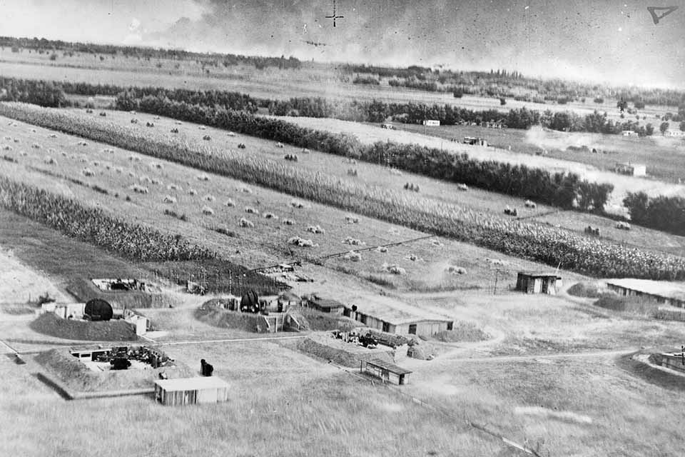 A radar-directed flak battery awaits B-24s in the distance. German and Romanian defenders found the low-flying Liberators easy targets. (National Archives)