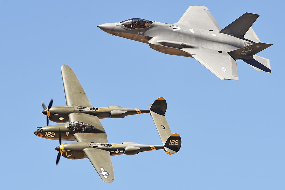 Old Lightning meets new: The Planes of Fame Air Museum’s Lockheed P-38J flies with a Lockheed F-35A Lightning II of the 61st Fighter Squadron at the Andrews Airshow. (U.S. Air Force)