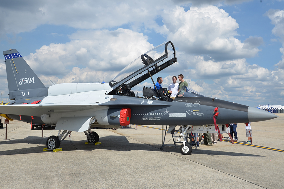 A Lockheed Martin rep shows off the cockpit of the company’s new T-50A trainer to airshow attendees. (Carl von Wodtke)