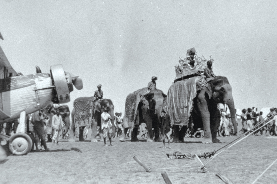 With the reassembled Wallace in the foreground, the expedition receives a royal welcome from local nobles on elephants in India. (David F. McIntyre Collection)