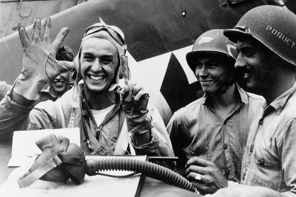 After returning to Lexington, Lieutenant Alex Vraciu celebrates his six victories scored on June 19, 1944. (National Archives)