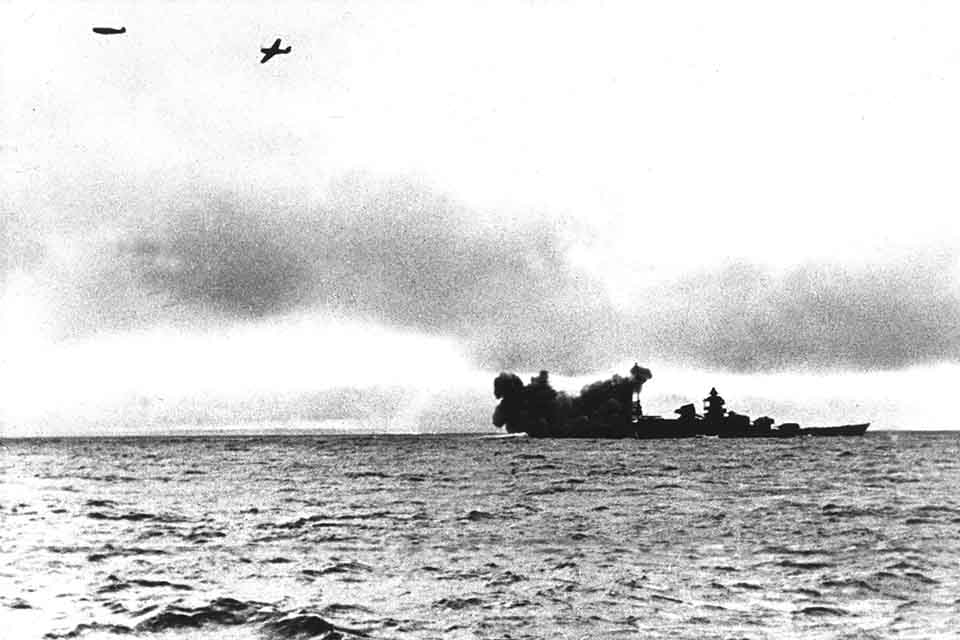 During its run through the channel the Scharnhorst fires its aft guns while two German fighters bore in on the attacking British planes. (Ullstein Bild via Getty Images)