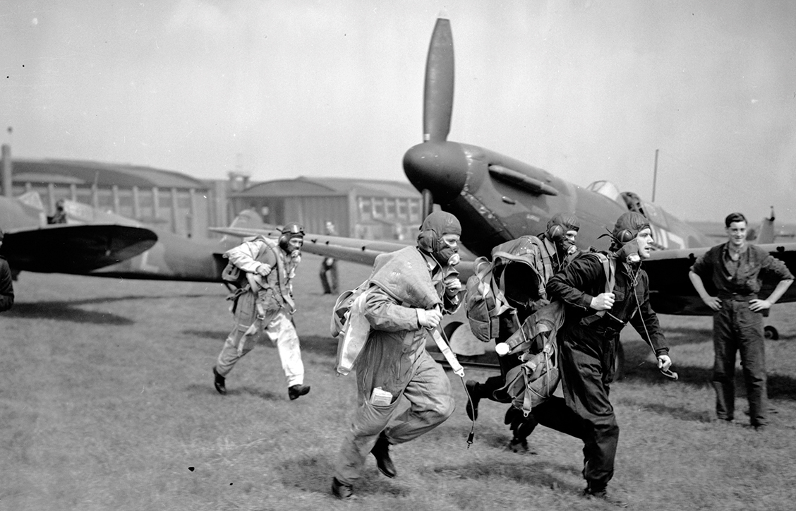 Pilots of the first Spitfire unit, No. 19 Squadron, stage a demonstration scramble at Duxford on May 4, 1939. (Jimmy Sime/Central Press/Getty Images)