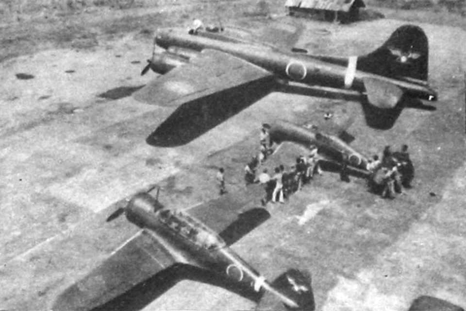 In a photograph probably taken at Tachikawa, a B-17E is parked with two Curtiss airplanes recovered on Java, an SNC-1 trainer and a CW-21B. (Courtesy of Robert C. Mikesh)