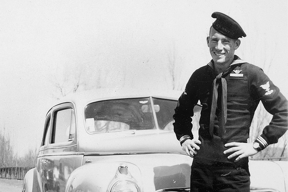 Jack Christopher poses proudly in his U.S. Navy dress blues in 1943. Barred from pilot training due to colorblindness, he selected aviation ordnance so he could at least fly as a crew member. (Courtesy of Jack Christopher)