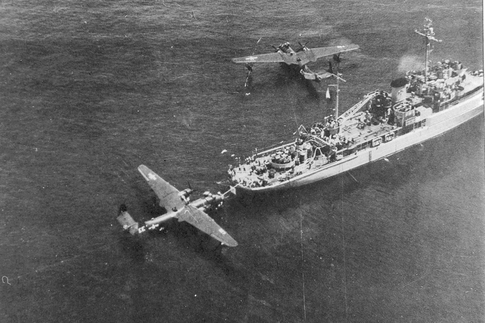 A PBM-5 refuels from behind a small seaplane tender, similar to Christopher’s “mother ship” Onslow, at Kerama Retto. VPB-27 needed three such vessels to accommodate its aircrews. (Courtesy of Jack Christopher)