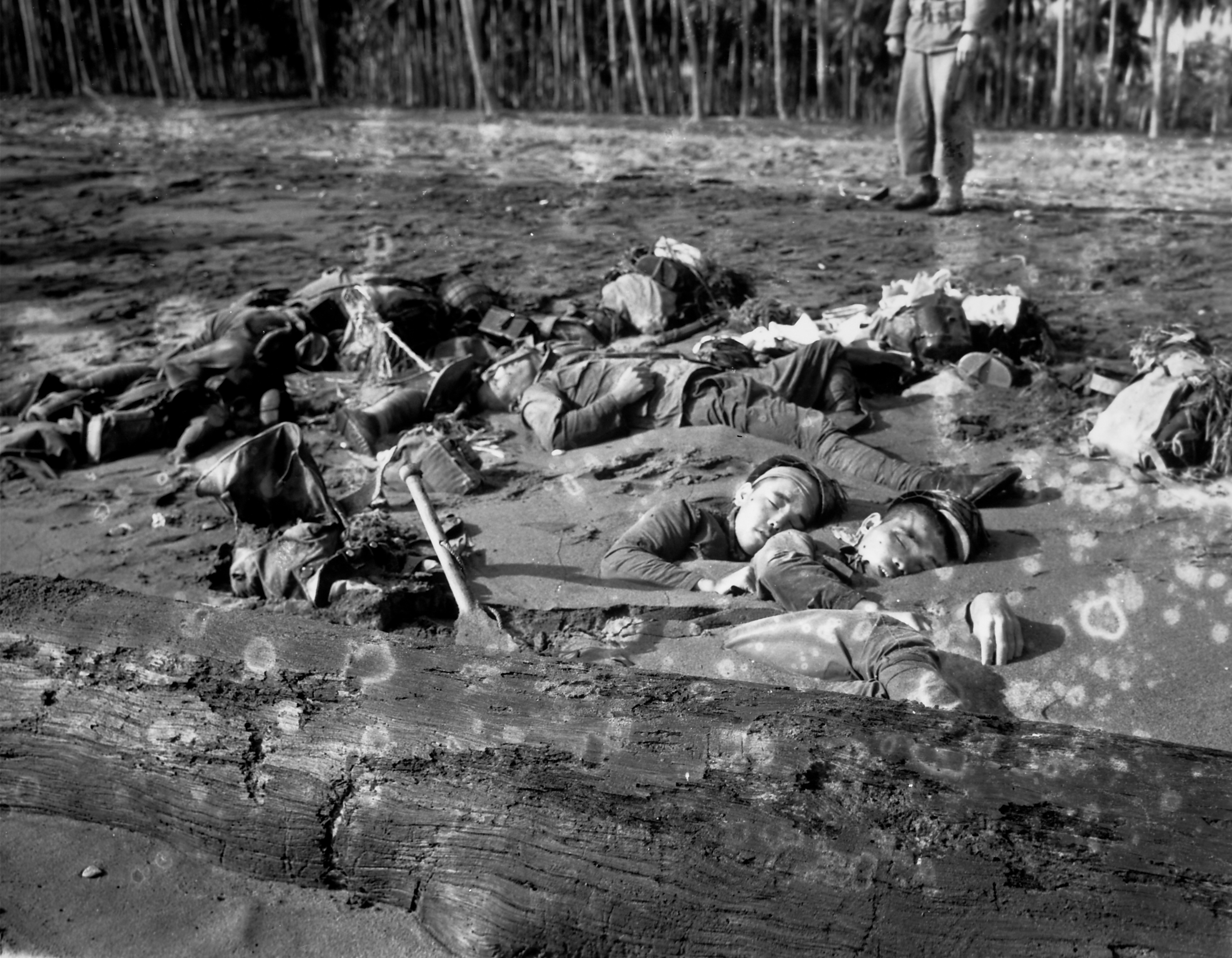 Corpses of Japanese soldiers half-buried in the tidal sands of the Tenaru River. (The LIFE Picture Collection/Getty Images)