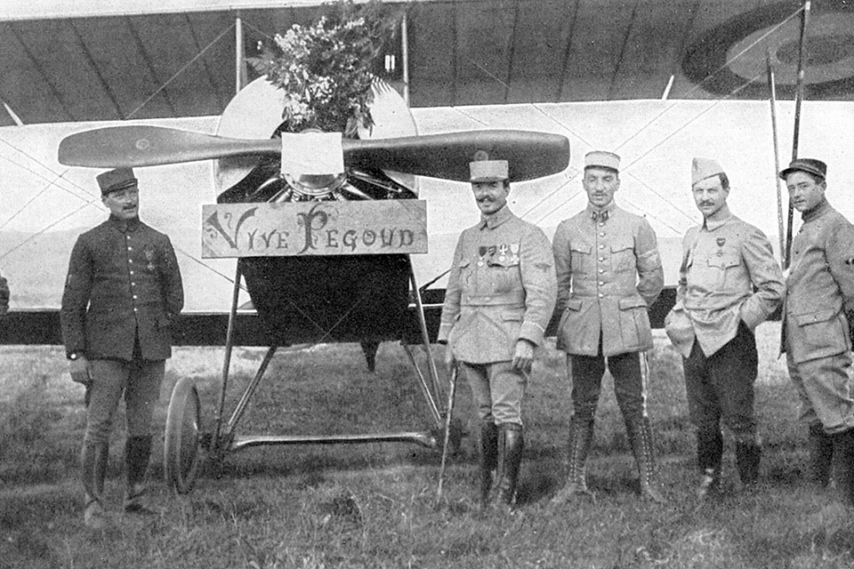 Adolphe Pegoud (4th from right) in front of his plane on the day when fellow officers presented him with a bouquet in celebration of his latest victory. (Universal History Archive/Getty Images)