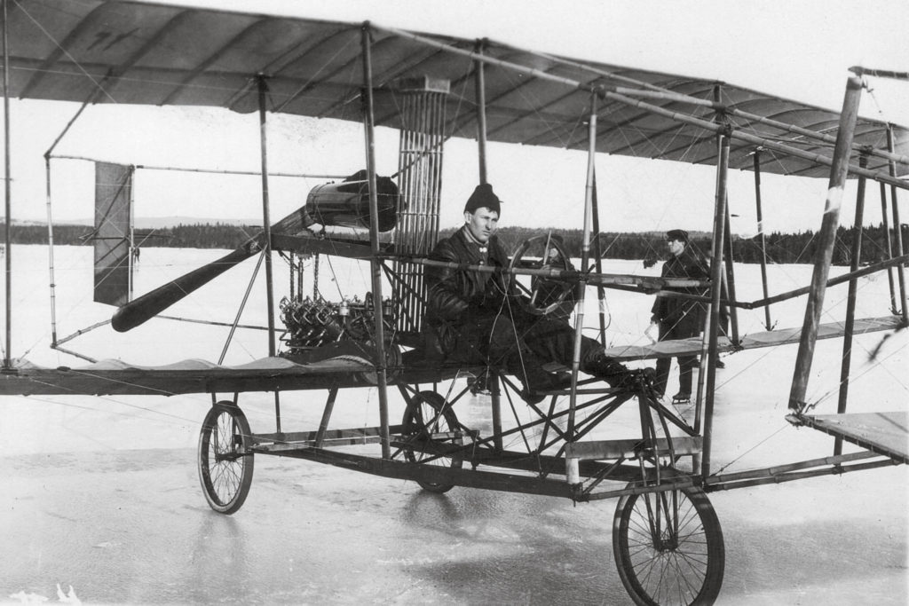 McCurdy in the driver's seat of the "Silver Dart." Un­like its predecessors, Silver Dart’s engine was mounted low, using a chain drive to turn the propeller. (Courtesy of the Glenn H. Curtiss Museum, Hammondsport, NY)