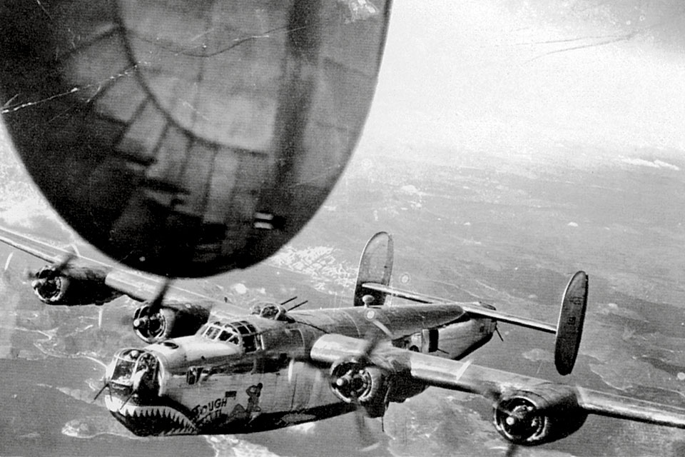 Consolidated B-24J "Tough Titti" of the Fourteenth Air Force’s 308th Bomb Group was photographed by another B-24 crewman over China.