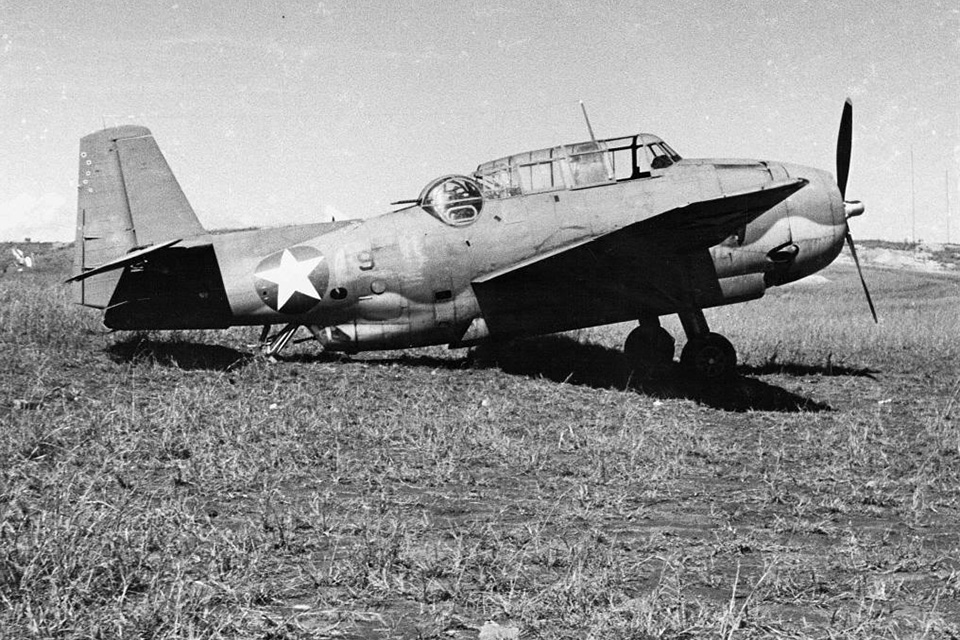One of VT-8's handbuilt Avengers in the grass at Henderson Field, ready for the next sortie. (National Archives)