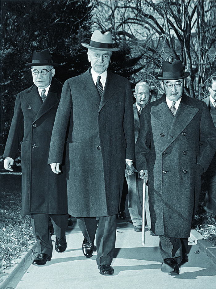 Japanese ambassador Kichisaburo Nomura and special envoy Saburo Kurusu flank U.S. Secretary of State Cordell Hull en route to the White House. Bottom: personnel depart the Japanese embassy for detainment, eventually at the Greenbrier. (Photo by Underwood Archives/Getty Images)