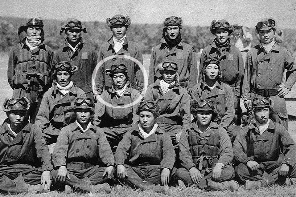 Sakai (circled) poses with members of the Tainan Kokutai, including fellow aces Hiroyoshi Nishizawa (standing at far left) and Toshio Ota (seated to Sakai’s right). (HistoryNet Archive)