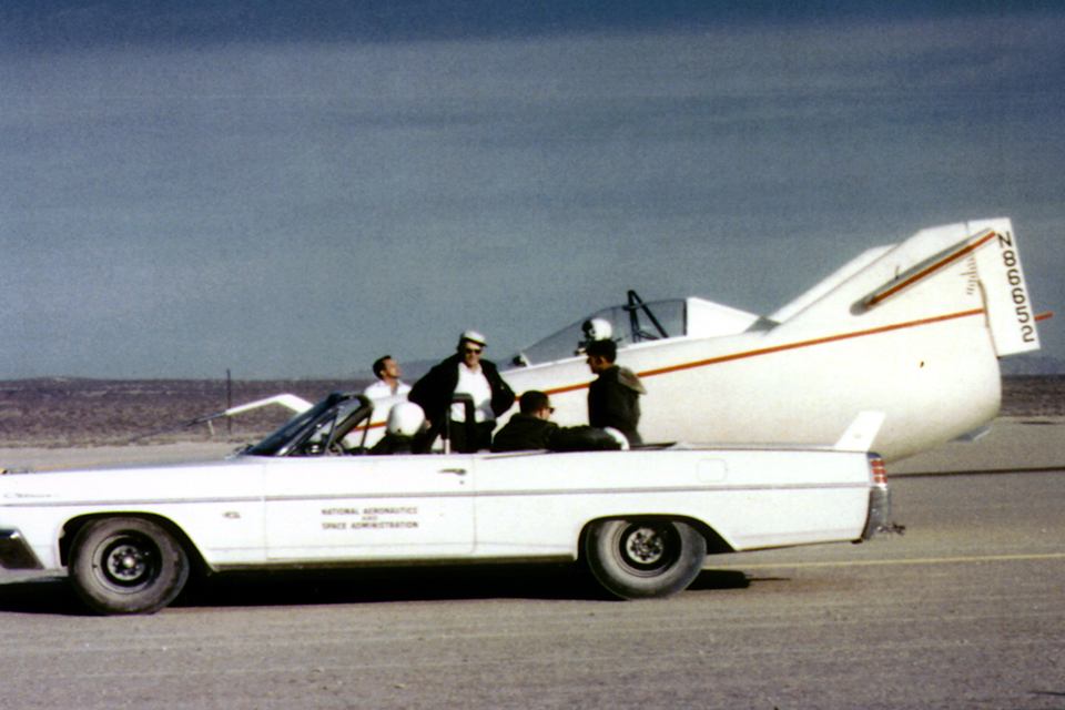 The Pontiac with its NASA markings next to the M2-F1. In the cockpit is Milt Thompson. (NASA)