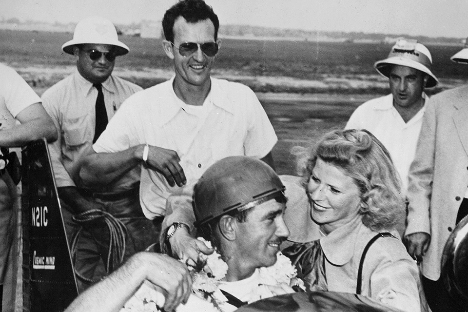 Herman “Fish” Salmon celebrates his win in the 1948 Goodyear Midget race while "Minnow" designer Tony Levier (behind him) looks on. (San Diego Air & Space Museum)