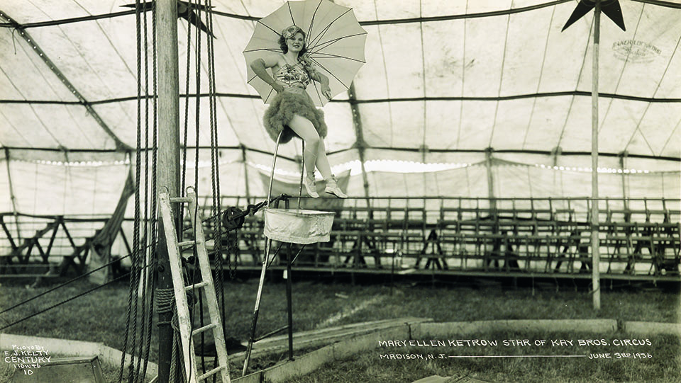 On the High Wire: Tightrope walkers defied gravity in stunts uncorked far overhead. Umbrellas and poles, used for balance, were also part of the act. (Courtesy Swann Auction Galleries)