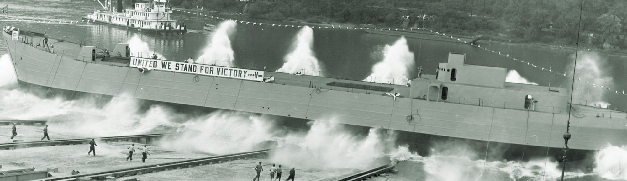 A spanking new LST slides down the ways at Pittsburgh’s Neville Island Shipyard, on the Ohio River. From there, it would travel downriver to New Orleans to be fitted out. (United States Naval Institute)