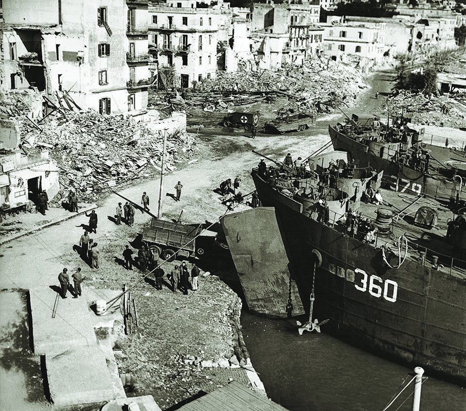 Two LSTs loom over Anzio’s ruined harbor. The steady stream of supplies and reinforcements the vessels provided allowed Allied troops to hold fast there despite fierce German resistance. (Keystone-France\Gamma-Rapho via Getty Images)