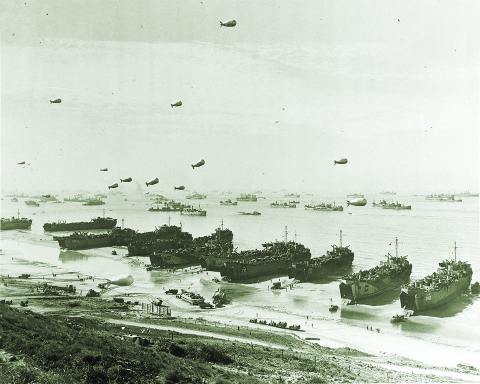 Shortly after the Normandy Invasion, a row of American and British LSTs dominates the shore. (U.S. Navy/National Archives)