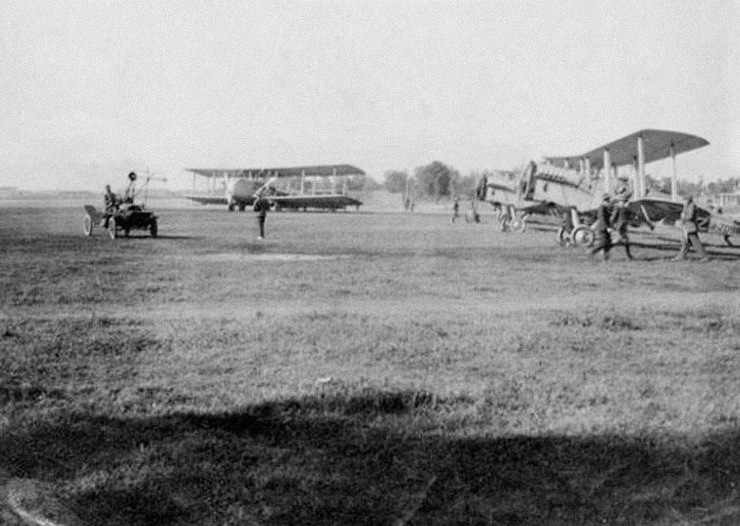 The first evacuation flight lands at Peshawar, then part of a greater, British-ruled India (now part of Pakistan). One of No. 70 Squadron's Vickers Victoria transports rests near two de Havilland DH-9As. (IWM HU 14496)