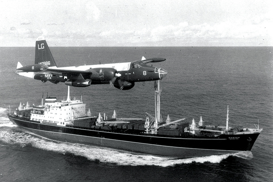 A P2V-7 of VP-18 flies past the Soviet freighter "Okhotsk," searching for nuclear weapons during the Cuban Missile Crisis in October 1962. (Getty Images)