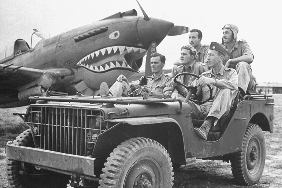 Mugging for a publicity shot, Newkirk (left) joins Henry Geselbracht (middle), James Howard (steering), and Bill Bartling and Bob Layher (back seat) in a jeep. (George Rodger/Time Life Pictures/Getty Images)