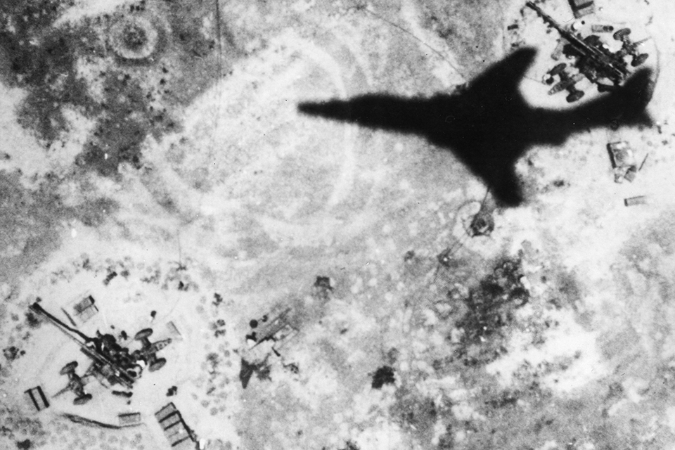 The shadow of an RF-101C is caught on the jets film as well as North Vietnamese anti-aircraft emplacements. (U.S. Air Force)