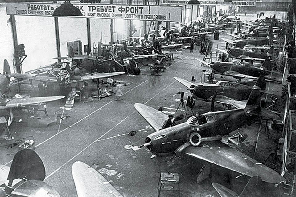 Soviet workers build Yak-1s in the assembly shop of a state-run aircraft factory during 1942. (© Sovfoto)