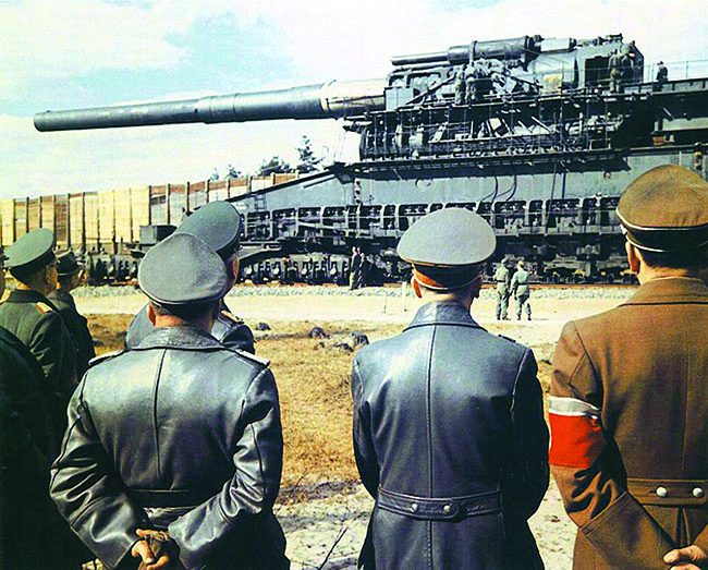 Hitler (center) and entourage examine the immense Heavy Gustav railway gun in April 1943— a weapon as impractical as it was large. (AKG-images/WHA/World History Archive)