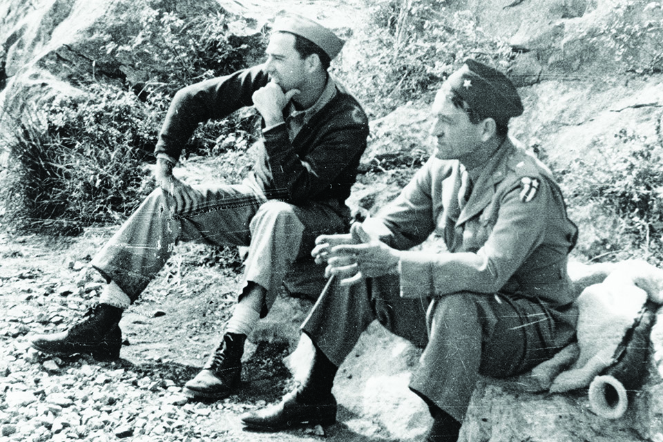 Scott (left) and Brig. Gen. Claire L. Chennault confer as the American Volunteer Group transitions into the 23rd Fighter Group in the summer of 1942. (National Archives)