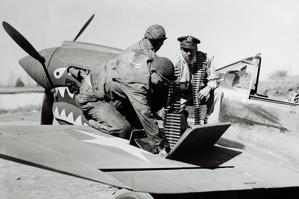 The colonel helps load his guns for his last sortie from Kunming, China. (National Archives)