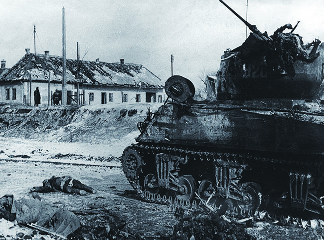 At Székesfehérvár, a Soviet tank—a Lend-Lease U.S. M4 Sherman—and its crew lie dead. (Süddeutsche Zeitung Photo/Alamy)
