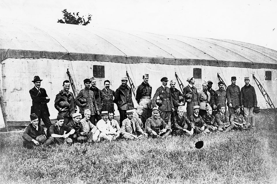 Eugene Bullard (standing fourth from the right), his Croix de Guerre clearly visible and a flying helmet in his hand, poses with other student pilots at Avord, France. (U.S. Air Force)