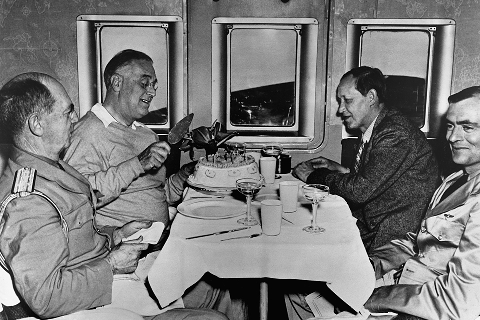 President Franklin D. Roosevelt celebrates his birthday aboard the Dixie Clipper en route to Casablanca, Morocco, in January 1943 to discuss European war strategy. (© Museum of Flight/Corbis)