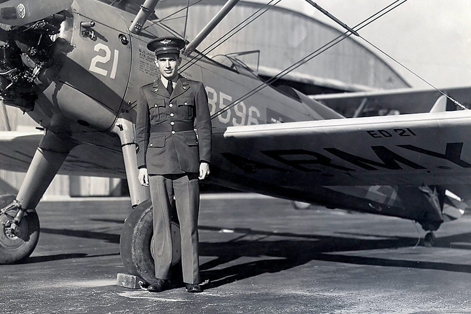 On December 7, 1941, Hess suprised his parishioners with the news that he would be joining the war effort as a pilot. Here he poses with a Boeing-Stearman PT-13 during flight training. (Courtesy of the Hess Family)