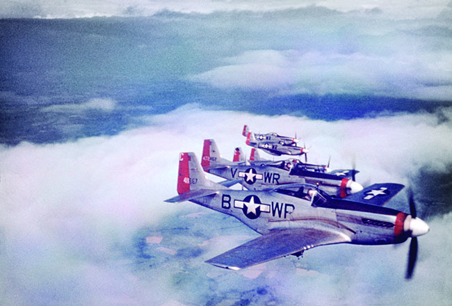 P-51 Mustangs of the 354th Fighter Squadron, 355th Fighter Group, fly in formation over East Anglia, England. First Lieutenant Richard A. Gray joined the unit late in the war. (Roger Freeman Collection, FRE 605)