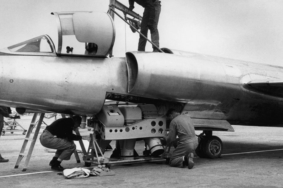 Technicians load a type A-2 camera set into a U-2’s equipment bay, or “Q-bay.” (U.S. Air Force)